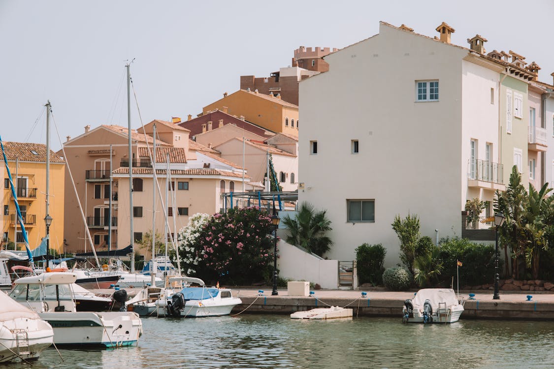 Buildings near Moored Motorboats in Town