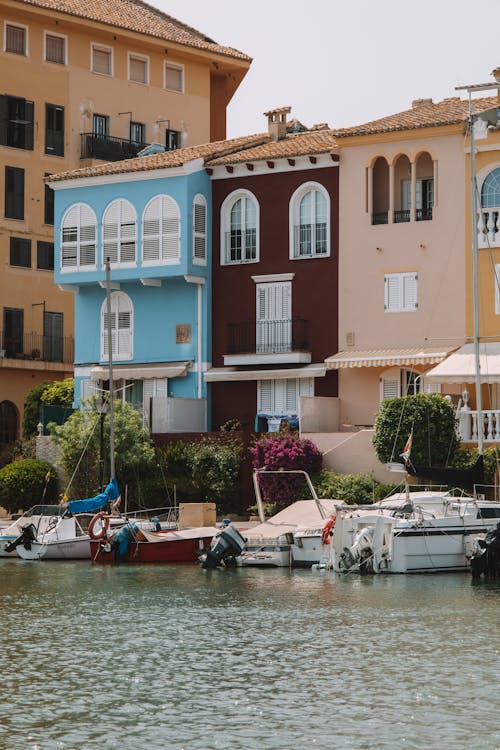 Motorboats and Houses on Shore