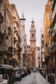 Scenic view of Valencia's charming street with historical architecture and vibrant city life.
