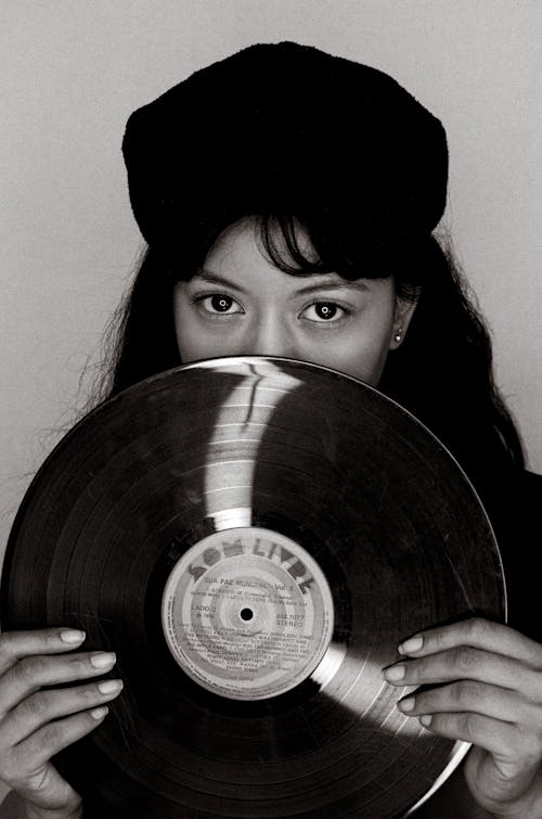 Woman Holding Vinyl Disk