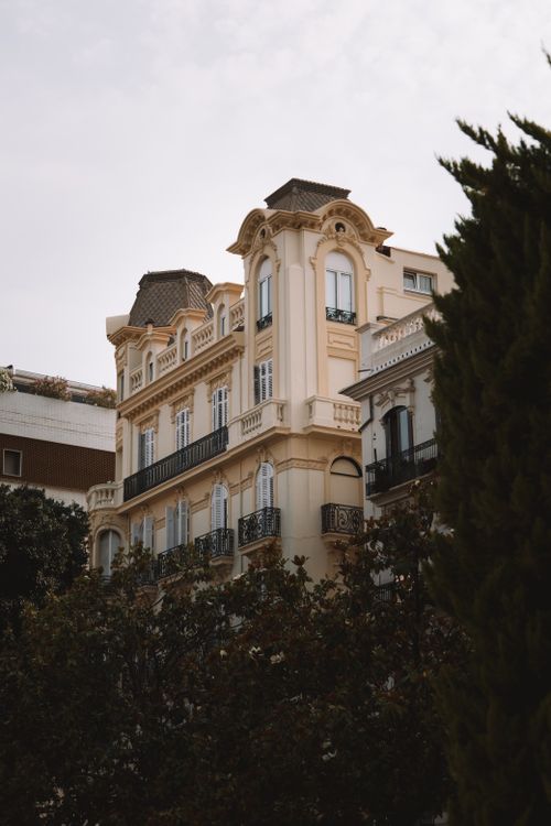 Free A beautifully detailed historic building in Valencia, Spain with ornate facades and balconies. Stock Photo