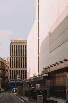 Modern architecture and urban street scene in Valencia, Spain, showcasing city life.