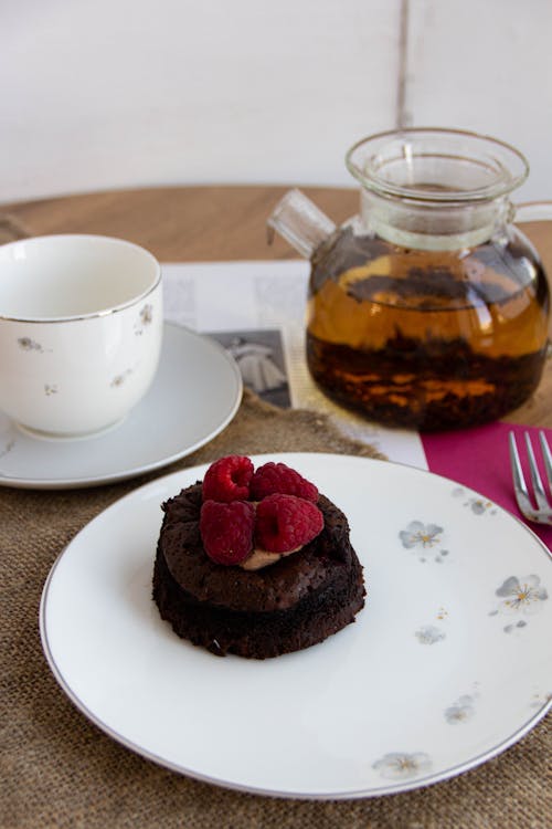 A Piece of Cake and Tea on the Table 