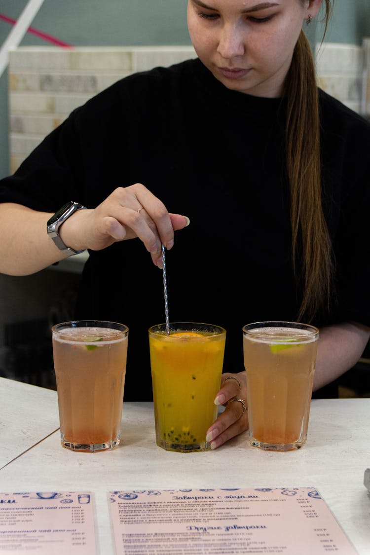 Woman Mixing Cocktails