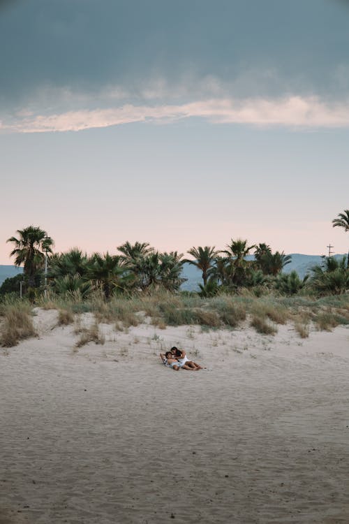 A Couple Lying on the Beach 