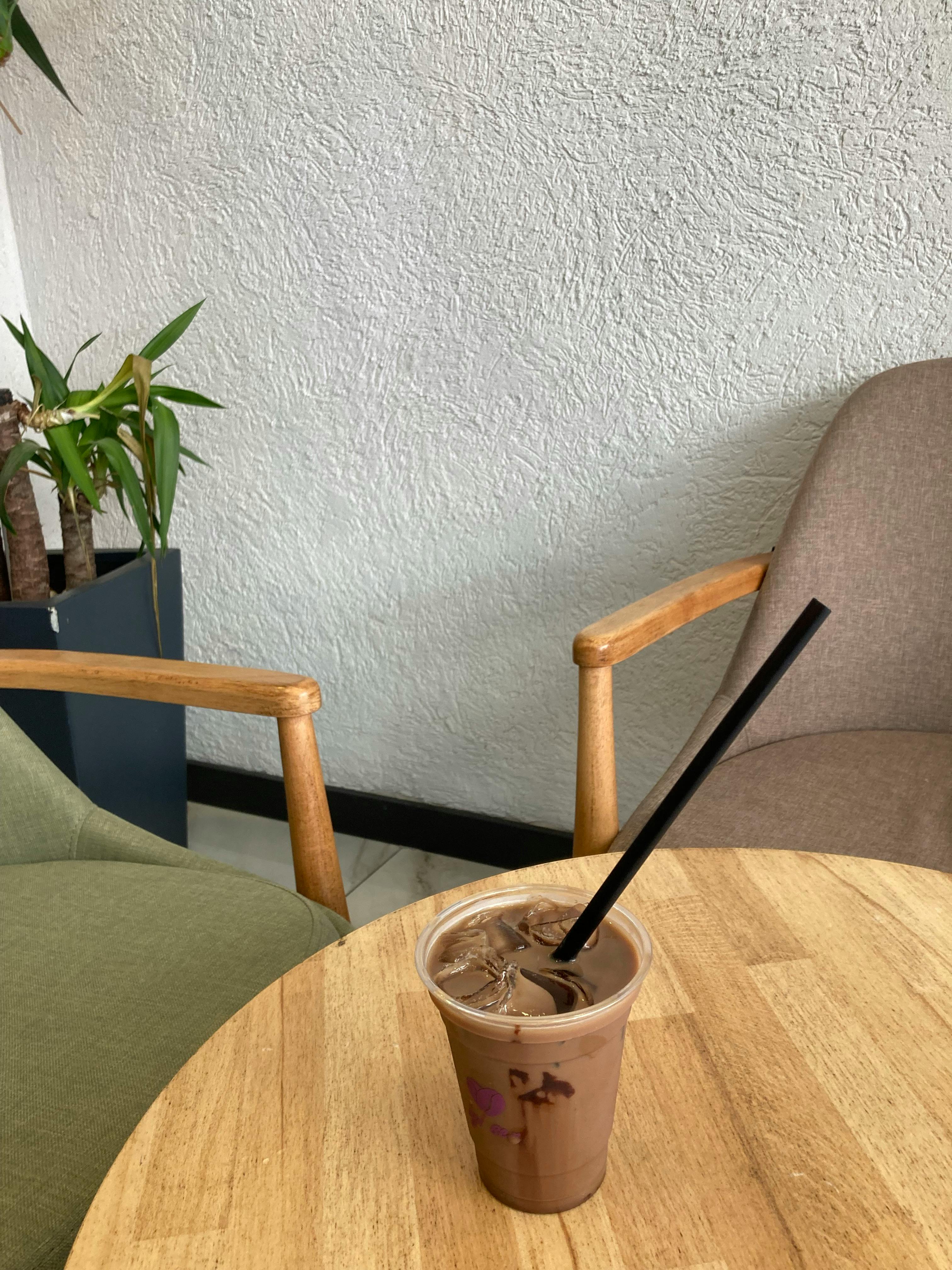 A Glass Jar Of Iced Coffee On The Table Stock Photo, Picture and Royalty  Free Image. Image 93747087.