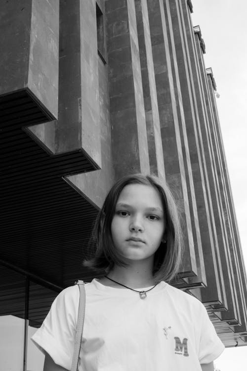 Girl Posing near Geometric Building