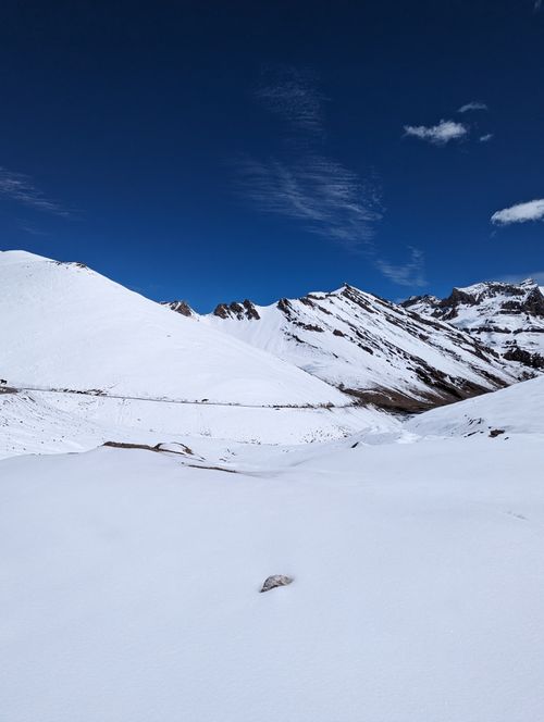 Free Breathtaking view of snowcapped mountains and clear blue sky, offering tranquility and natural beauty. Stock Photo