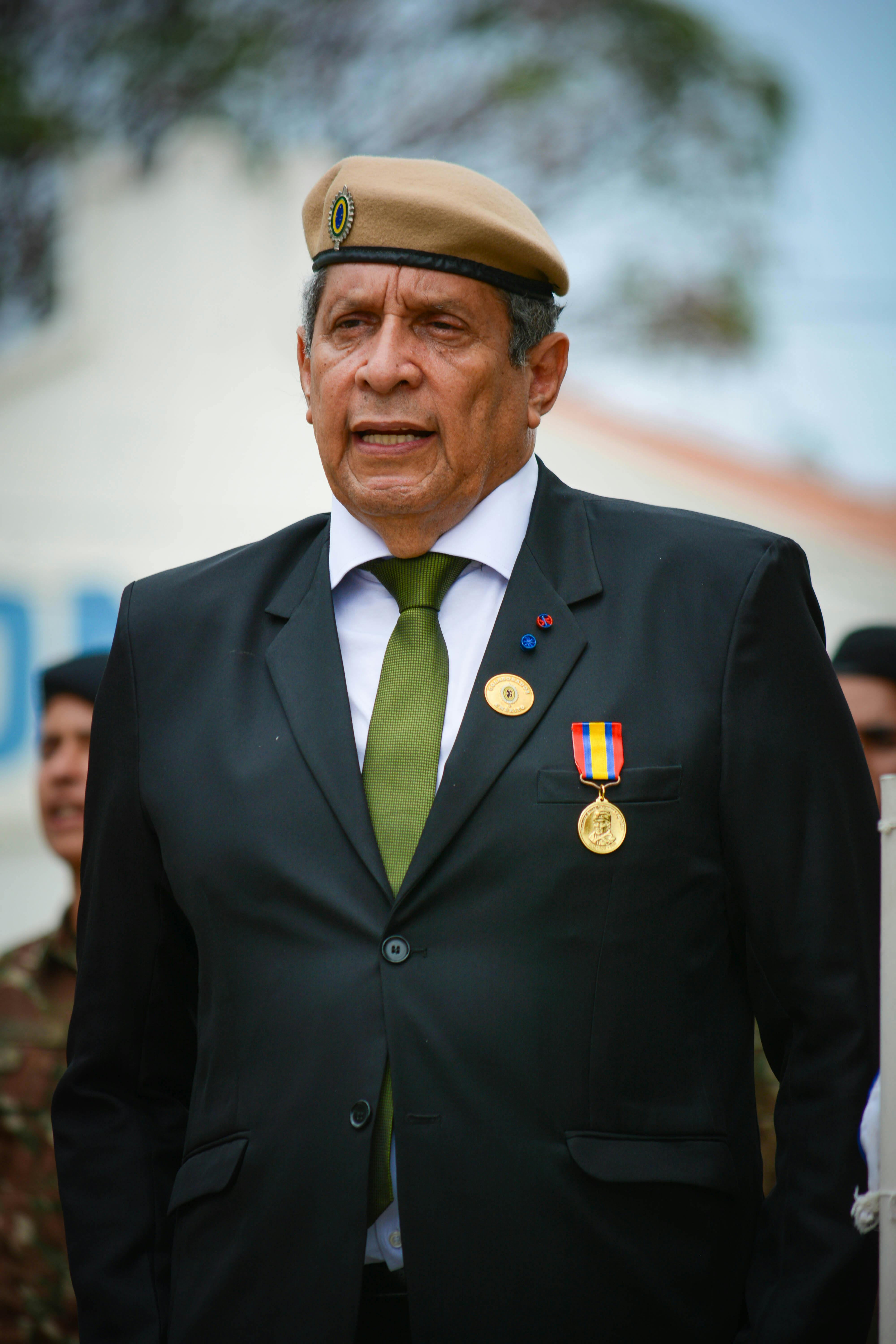 man in suit with medal