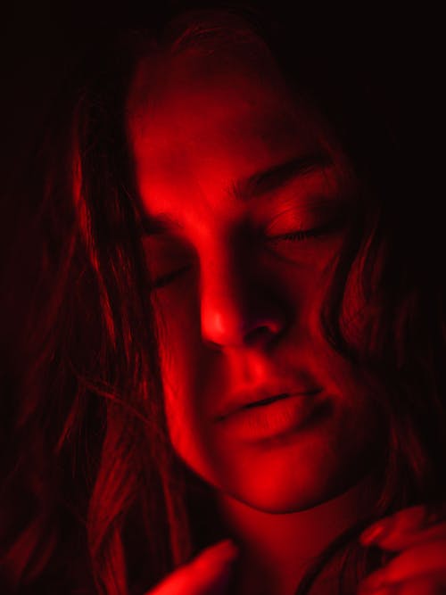 Close-up of Woman Face in Red Light