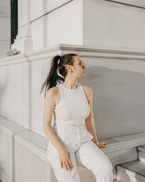 Woman in White Pants and Tank Top