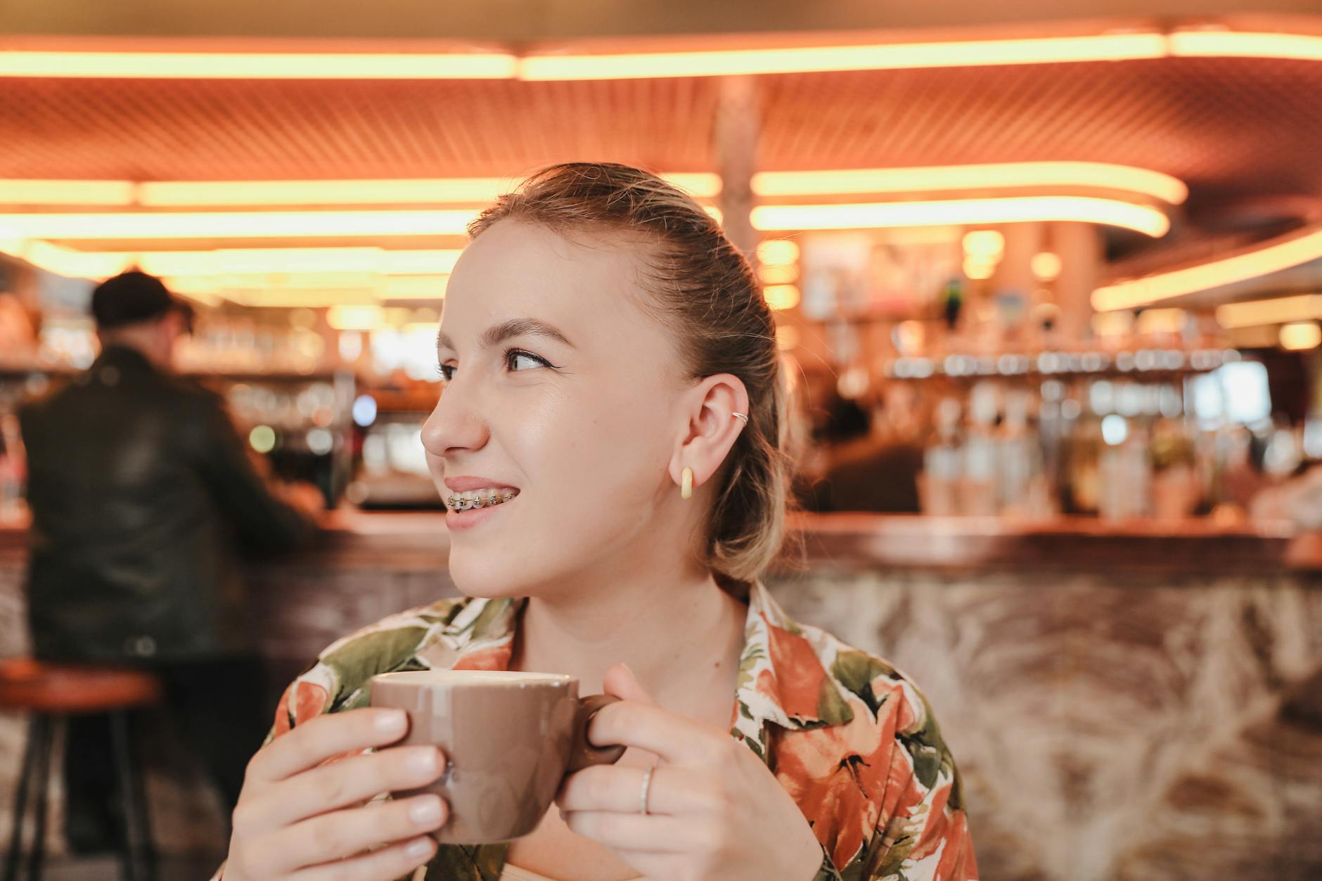 A woman drinking coffee in a cafe