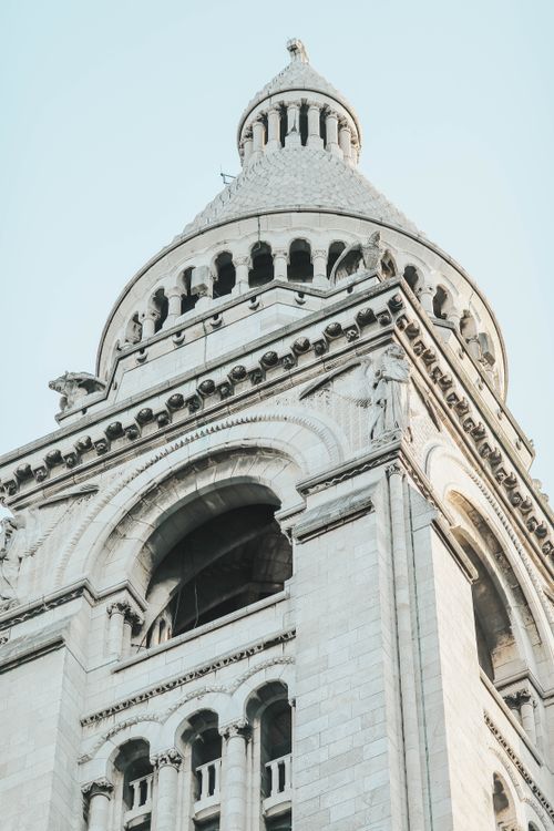 Free Close-up of the iconic Sacre Coeur Basilica tower in Paris showcasing intricate architectural details. Stock Photo