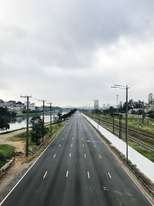 Gray Concrete Road Under the Gray Sky