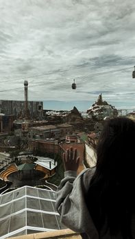 A picturesque view of Genting Highlands with cable cars and a scenic landscape.