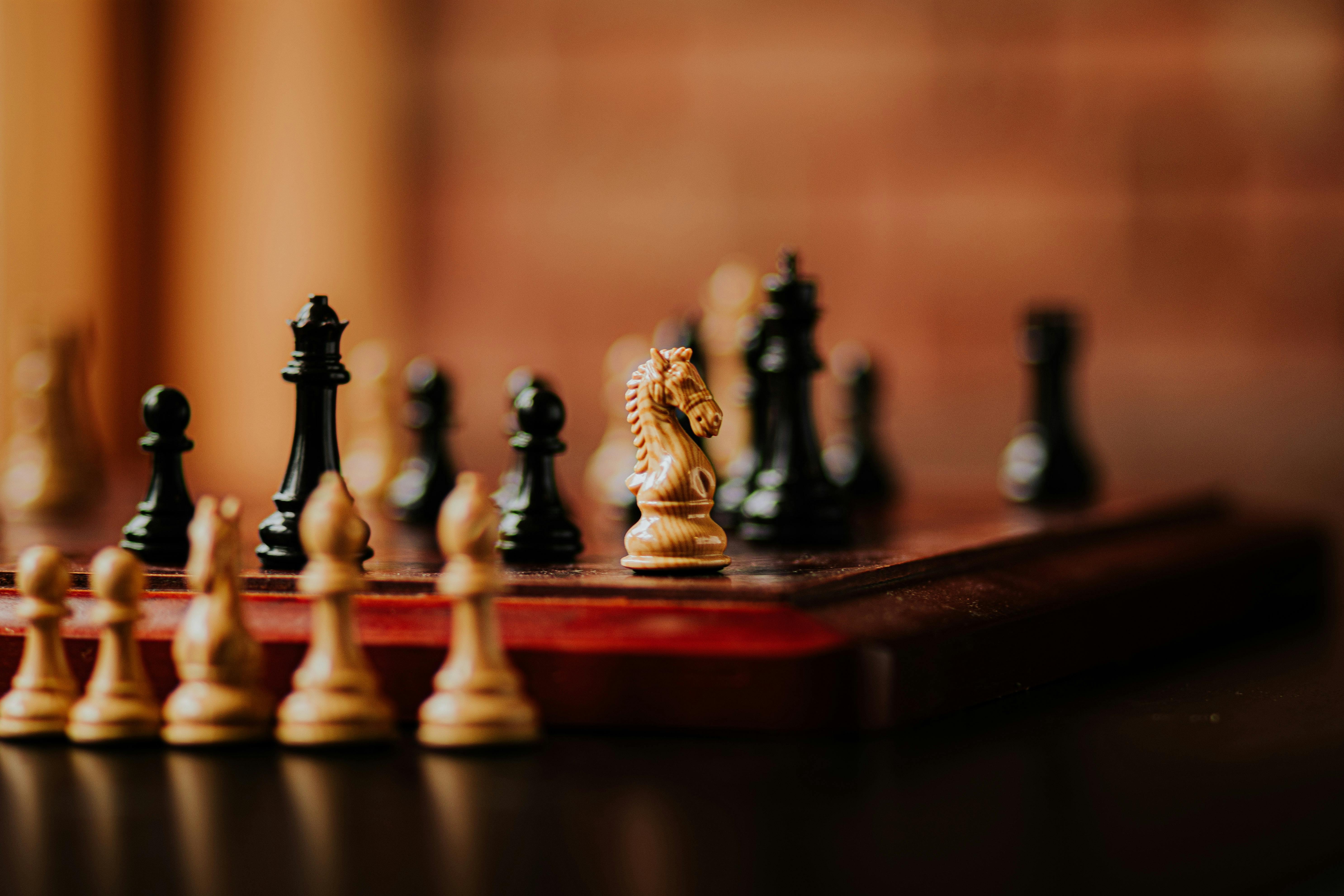 Close-up of chess game and chess pieces on table 4k from Pikwizard