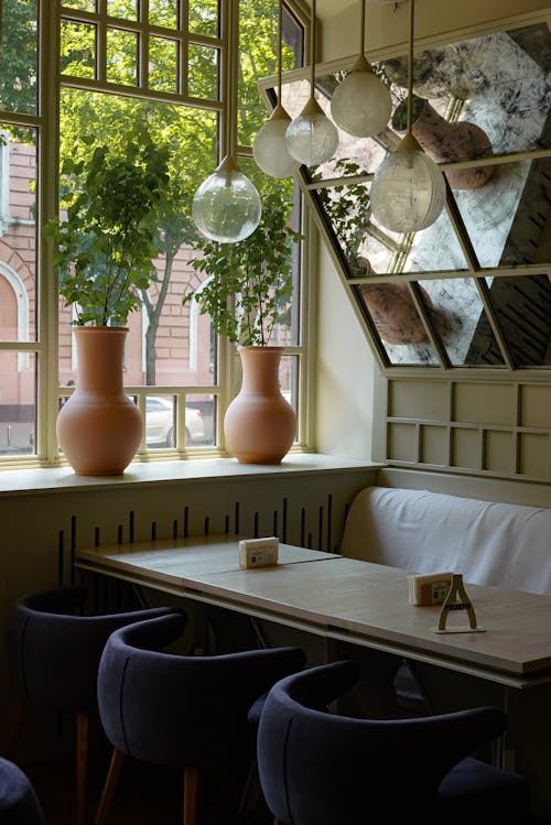 Restaurant Interior with Vases near the Window 
