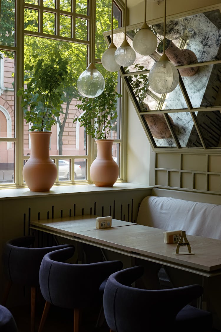 Restaurant Interior With Vases Near The Window 