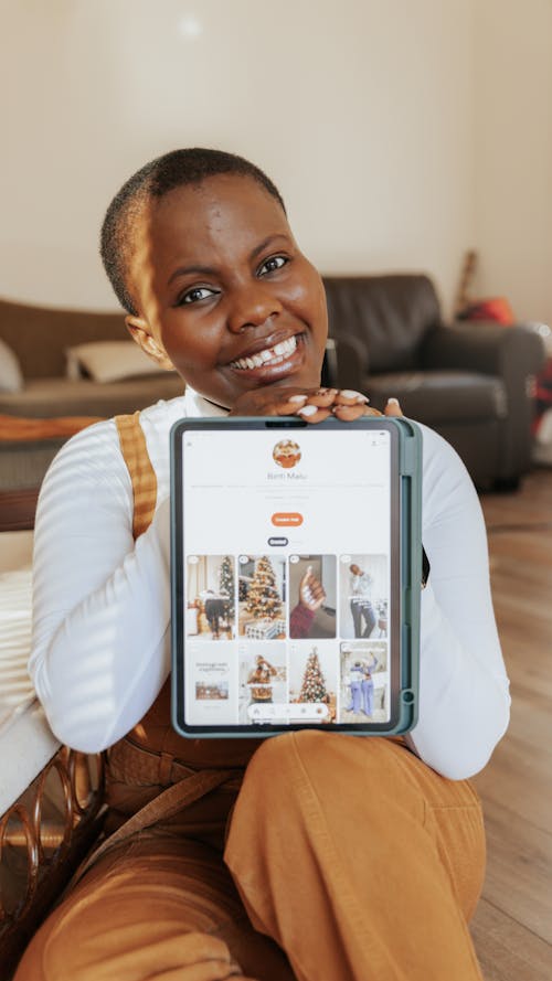 Smiling Woman Showing Tablet Screen