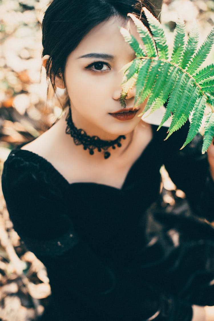 Girl Holding Fern