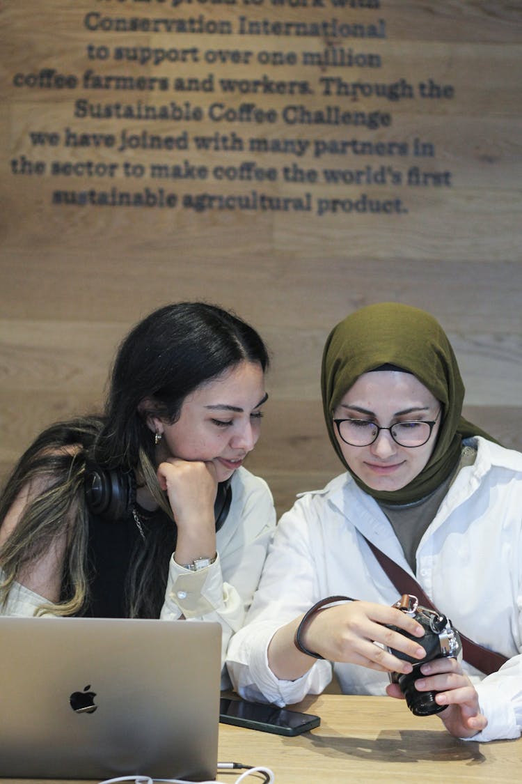 Women Looking On Camera Screen