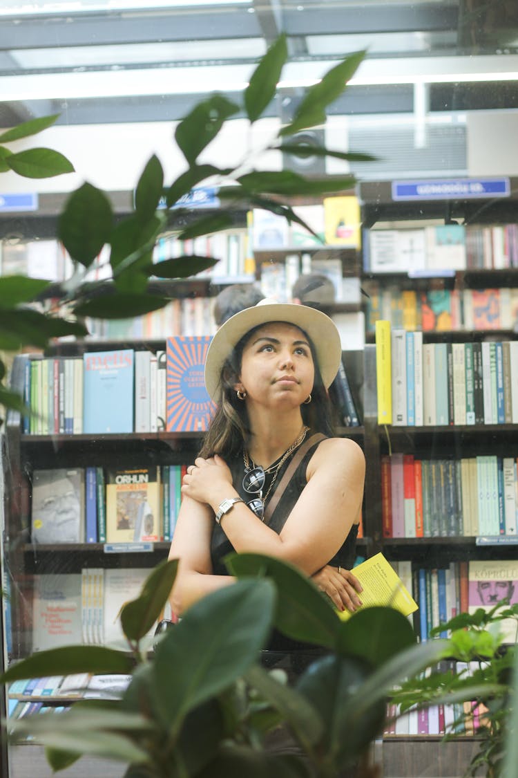 Customer Choosing Books In A Store