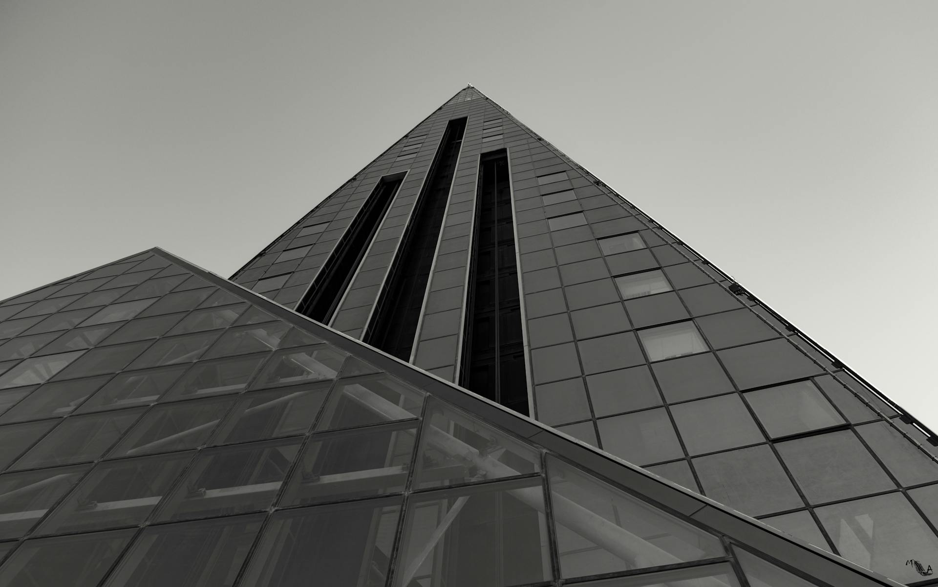 Black and white architectural shot of a modern skyscraper facade in Andorra la Vella.