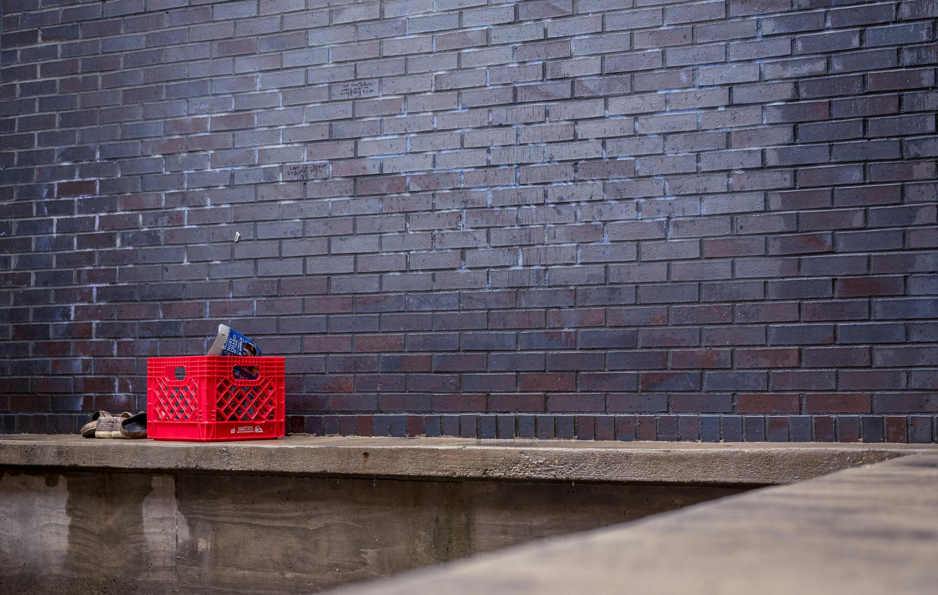 Crate next to Brick Wall