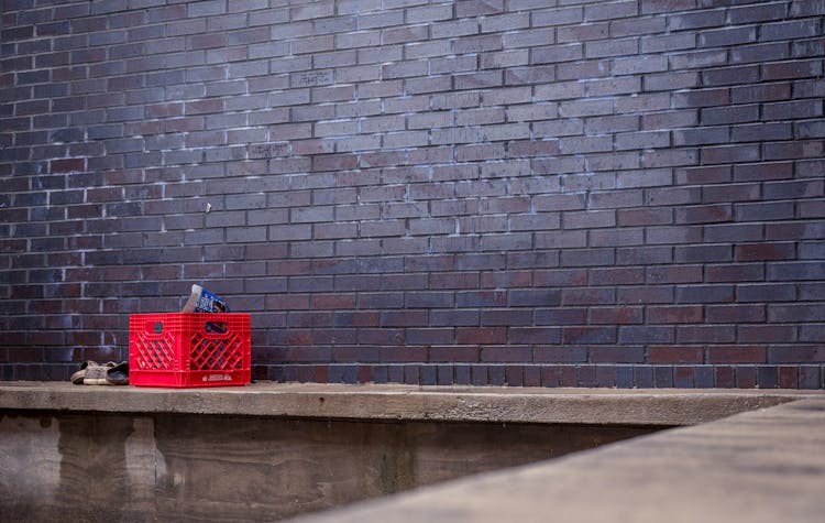 Crate Next To Brick Wall