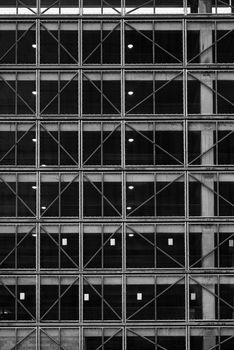 Black and white grid pattern of a modern building facade showcasing urban architecture.