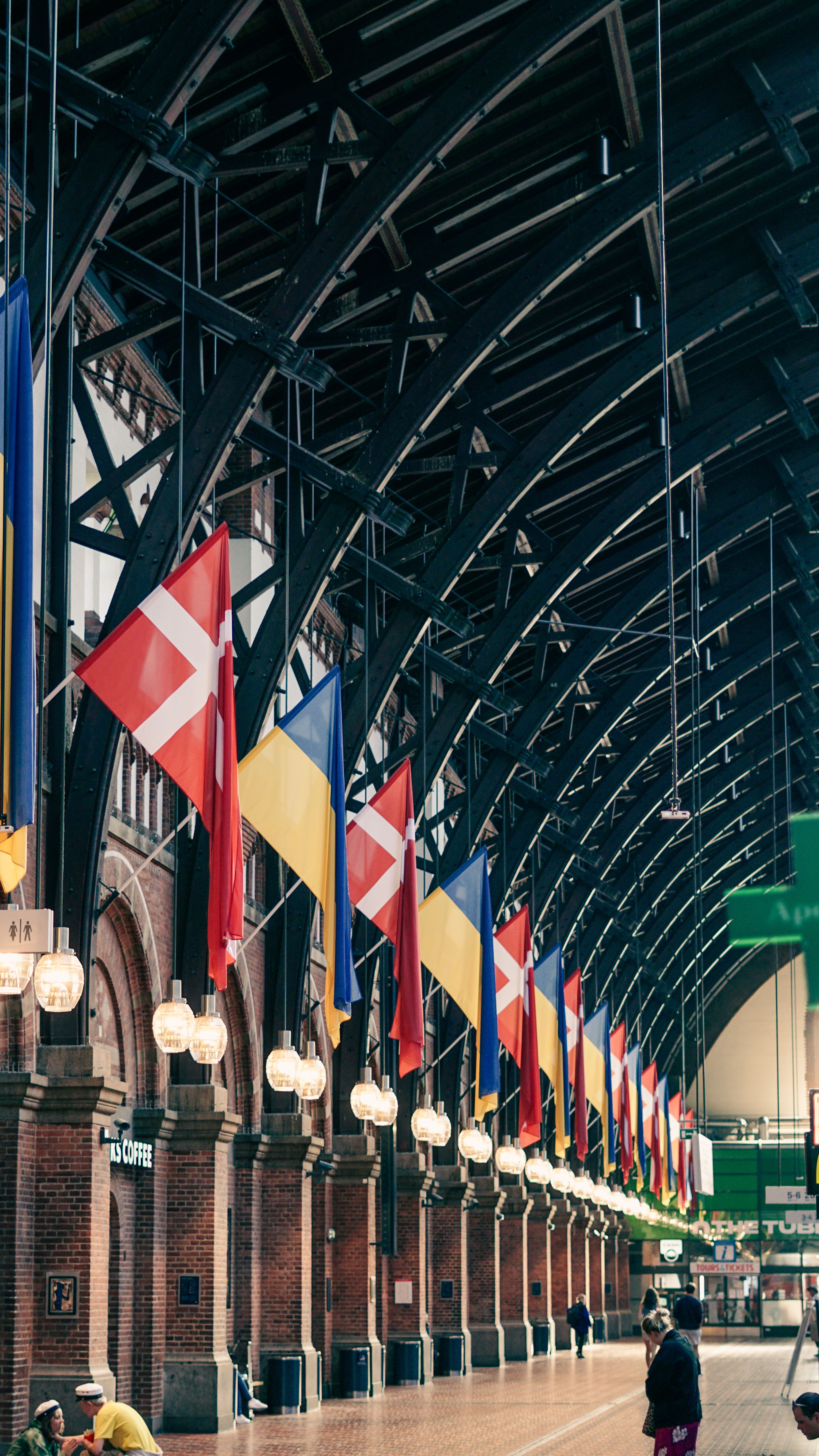 danish-and-ukrainian-flags-at-arrival-hall-of-a-central-station-in