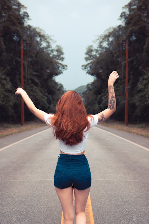 Free Photo of Woman Raising Her Hands Stock Photo