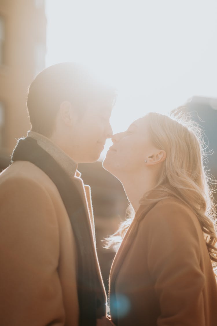 Happy Couple Kissing On Sunset