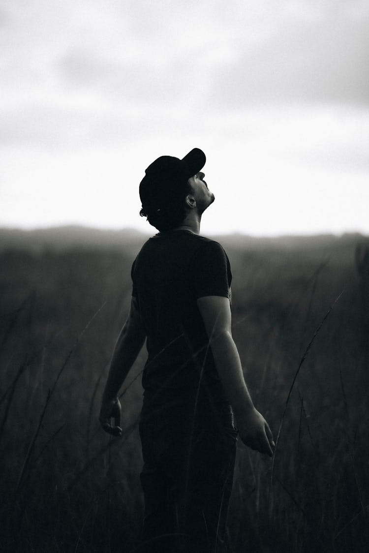 Man Standing On Meadow