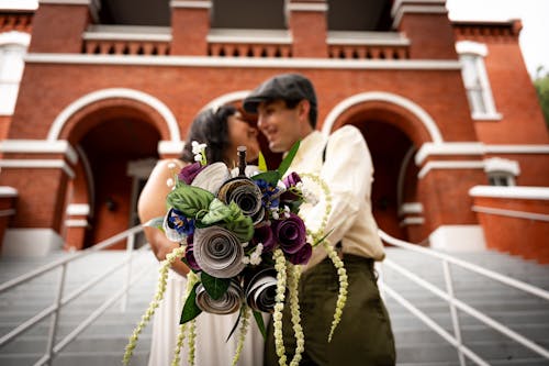Newlyweds with Flowers Bouquet
