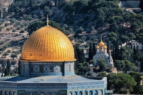 Free View of the Dome of the Rock with its golden dome in the historic city of Jerusalem. Stock Photo
