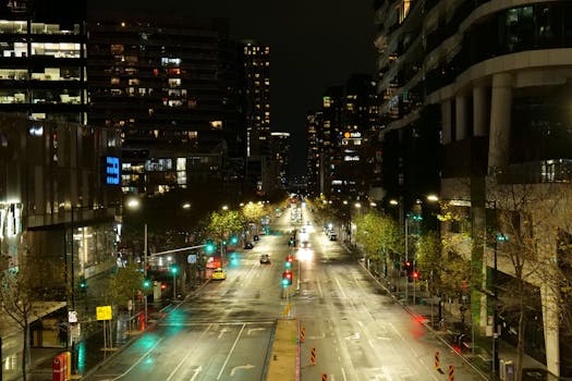 A serene night scene capturing the illuminated streets of Melbourne, Australia.