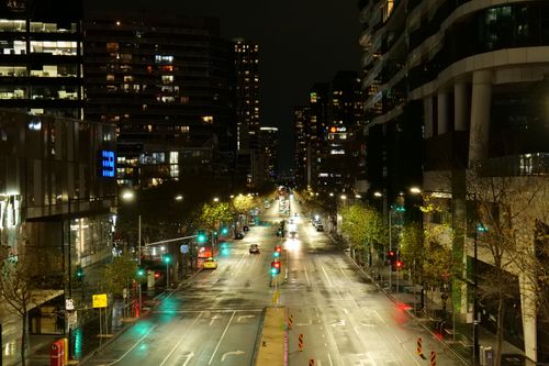 Free A serene night scene capturing the illuminated streets of Melbourne, Australia. Stock Photo