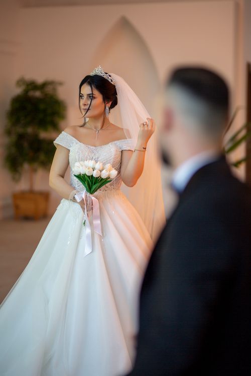 Free Bride in a stunning gown holding a bouquet during a wedding ceremony in Trabzon, Turkey. Stock Photo