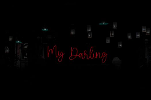 A dark interior with a red neon sign and hanging lanterns, exuding a moody ambiance.