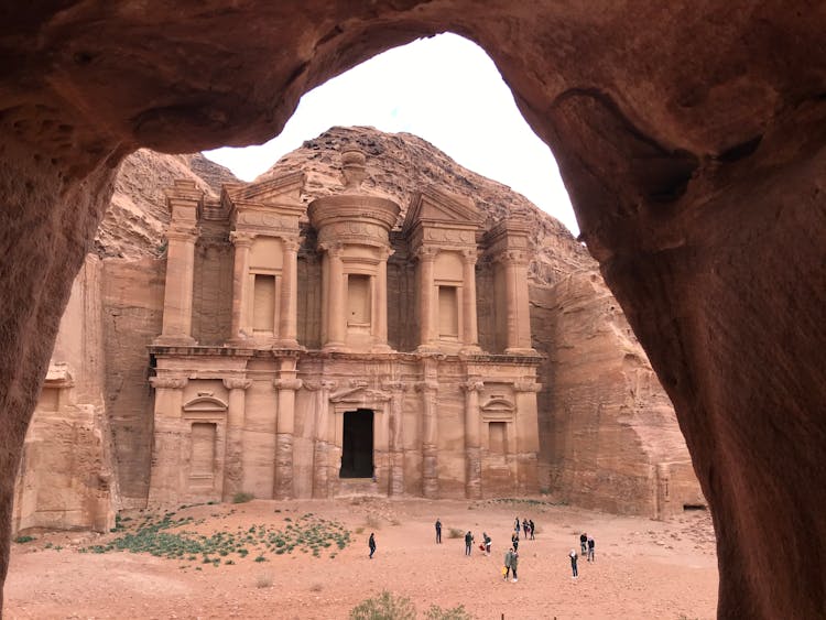 People Walking Near Ancient Ruins