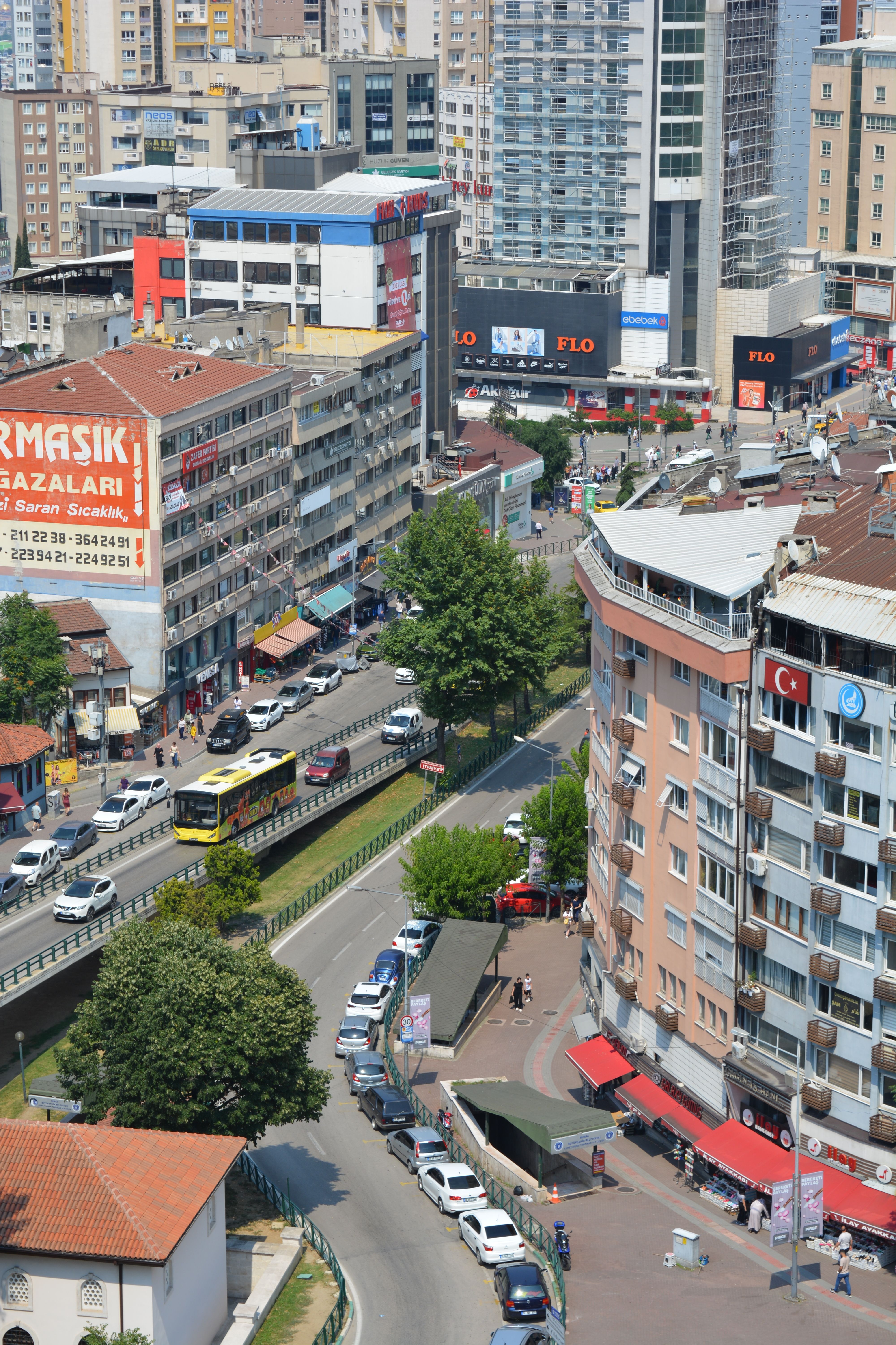Vibrant urban scene of Bursa city with busy streets, buildings, and traffic.