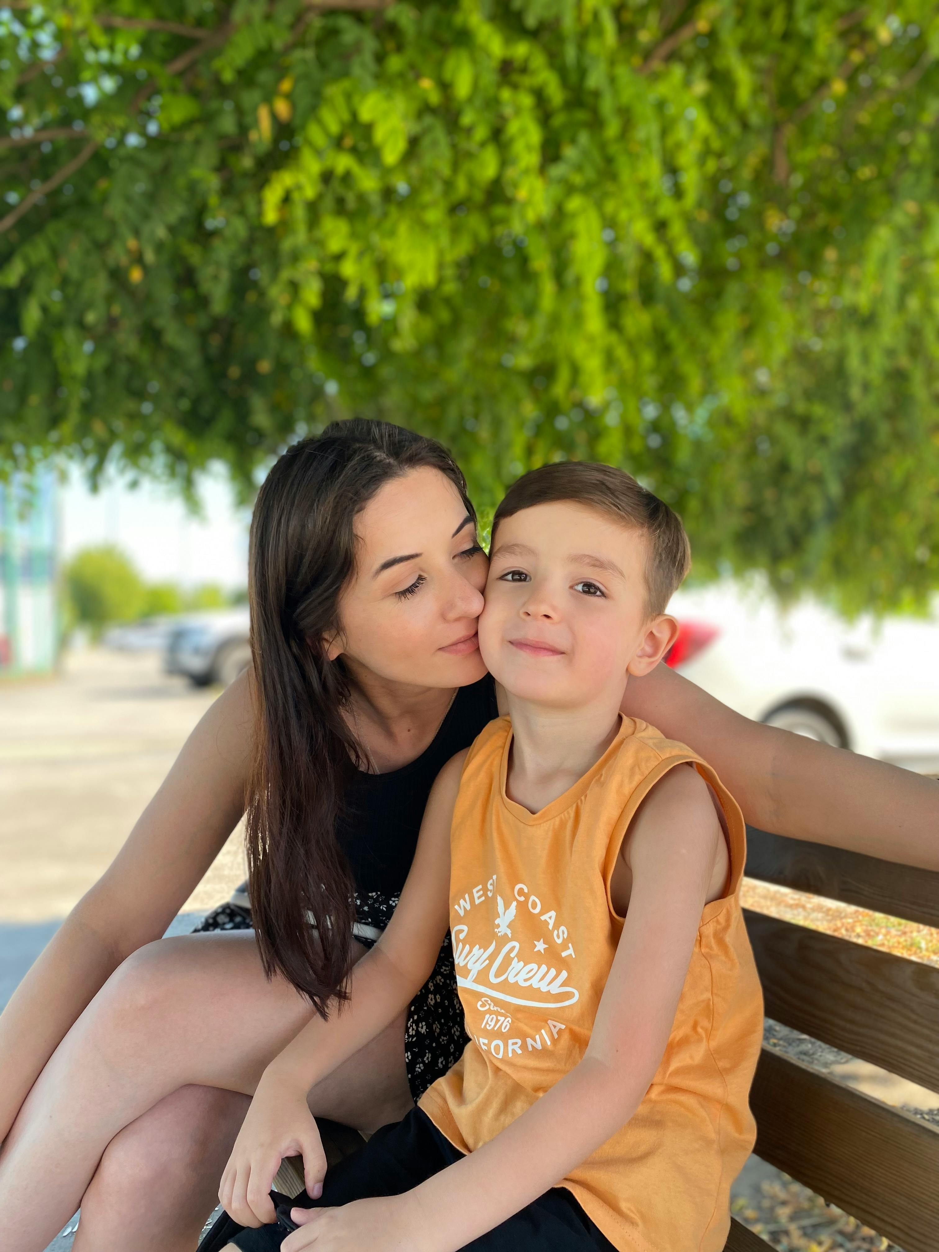 Mother Kissing Son · Free Stock Photo