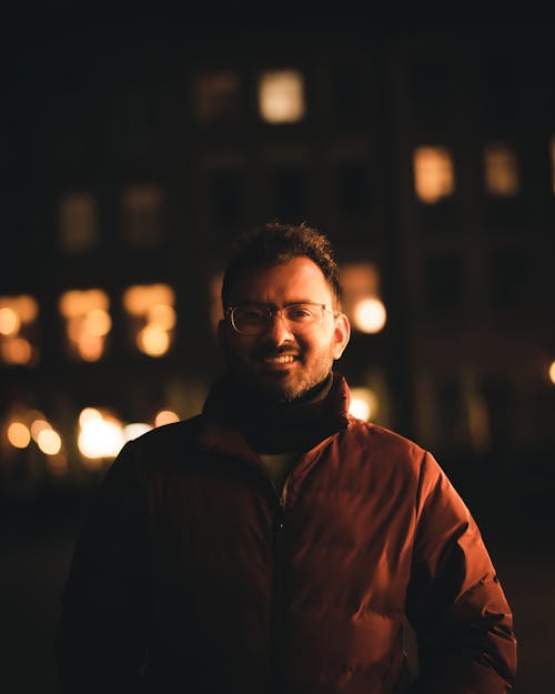 Smiling Man with Woolen Collar at Night