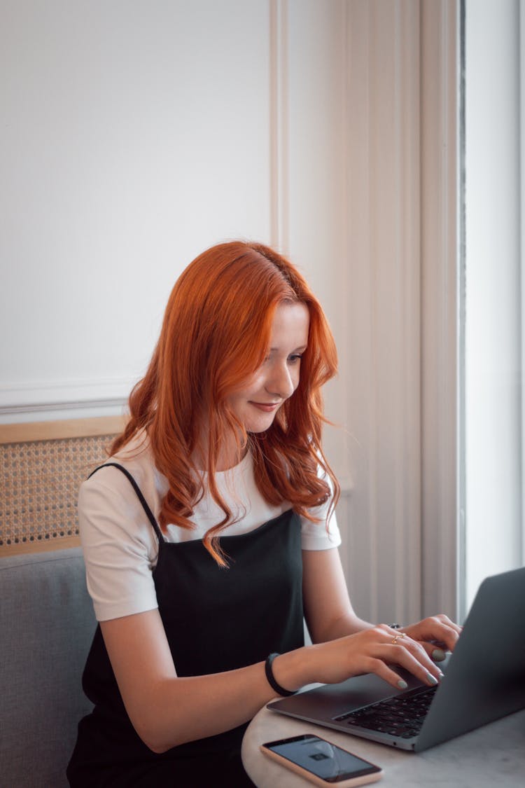 Woman Writing On Laptop