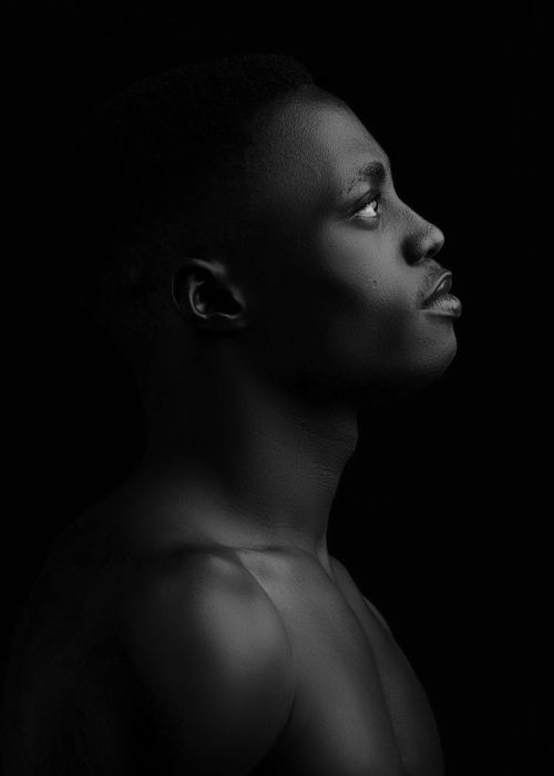 Free Dramatic black and white portrait of a muscular man looking up. Stock Photo