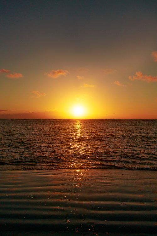 Free Breathtaking sunset over the ocean at Recife, Brazil. Perfect for serene and tranquil settings. Stock Photo