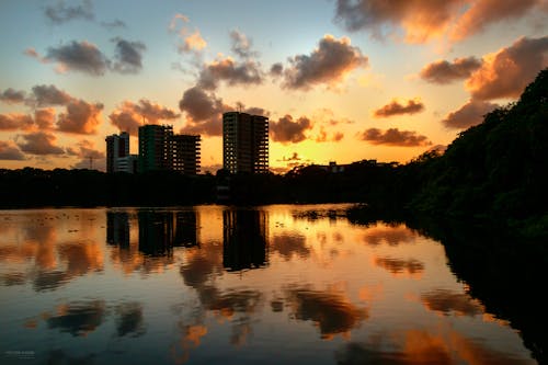 Lake with Buildings behind at Sunset