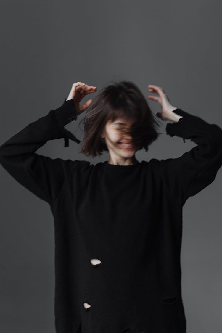 Brunette Woman Posing In Black Sweater