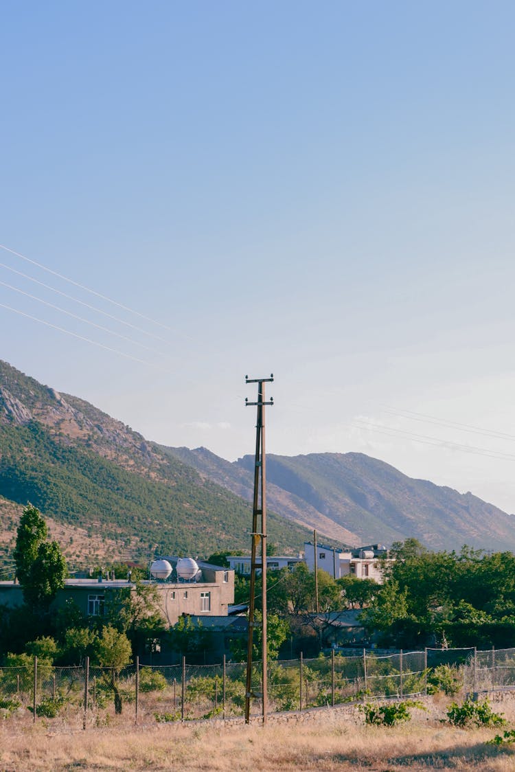 Hill And Village In Countryside